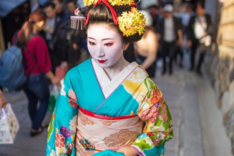 Maiko Apprentice Geisha walking up stairs in Gion, Kyoto